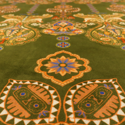 An intricate, bohemian-inspired pattern featuring ornate paisley motifs and stylized floral medallions in warm ochre, terracotta, and cerulean blue on a rich olive green background.