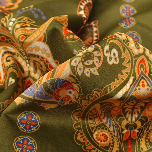 An intricate, bohemian-inspired pattern featuring ornate paisley motifs and stylized floral medallions in warm ochre, terracotta, and cerulean blue on a rich olive green background.