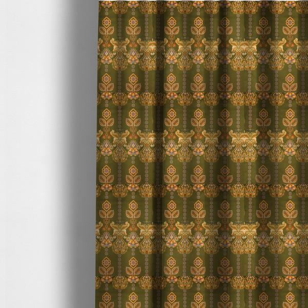 The fabric used to create these made-to-measure curtains is a intricate, bohemian-inspired pattern featuring ornate paisley motifs and stylized floral medallions in warm ochre, terracotta, and cerulean blue on a rich olive green background.
