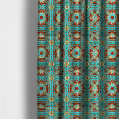 The fabric used to create these made-to-measure curtains is a vibrant and detailed ornamental fabric on a bright turquoise-azure background. The design features a large, symmetrical Persian-style medallion composed of warm terracotta, orange, and gold paisley motifs, framed by vertical geometric borders and diamond-shaped emblems in emerald green and ivory.