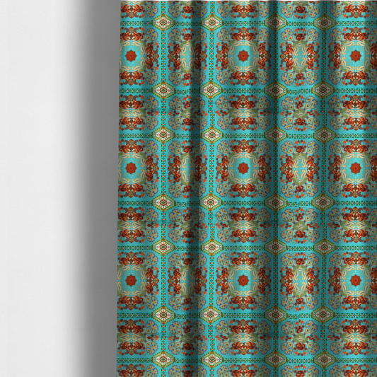 The fabric used to create these made-to-measure curtains is a vibrant and detailed ornamental fabric on a bright turquoise-azure background. The design features a large, symmetrical Persian-style medallion composed of warm terracotta, orange, and gold paisley motifs, framed by vertical geometric borders and diamond-shaped emblems in emerald green and ivory.