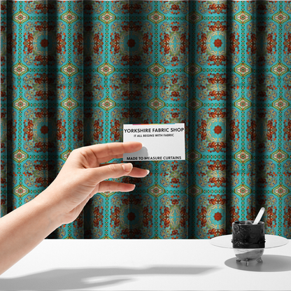 The fabric used to create these made-to-measure curtains is a vibrant and detailed ornamental fabric on a bright turquoise-azure background. The design features a large, symmetrical Persian-style medallion composed of warm terracotta, orange, and gold paisley motifs, framed by vertical geometric borders and diamond-shaped emblems in emerald green and ivory.