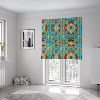 The fabric used to create these Roman blinds is a vibrant and detailed ornamental fabric on a bright turquoise-azure background. The design features a large, symmetrical Persian-style medallion composed of warm terracotta, orange, and gold paisley motifs, framed by vertical geometric borders and diamond-shaped emblems in emerald green and ivory.