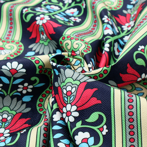 This fabric is a highly detailed, symmetrical textile pattern with a dark navy blue background. The design consists of repeating vertical floral motifs arranged in columns, separated by narrow, light-coloured striped bands.