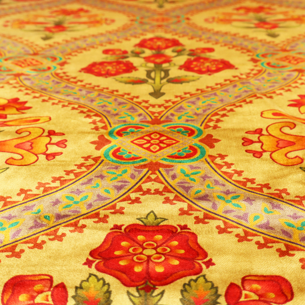 Ornate Gothic Revival fabric pattern featuring red and orange Tudor rose medallions framed by a gold ogival diamond lattice with teal accents.