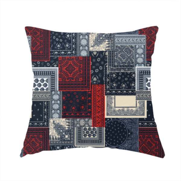 The fabric used to create this handmade cushion is a patchwork-style fabric print featuring a repetitive arrangement of square and rectangular blocks. Each block is filled with intricate navy blue, red, and cream-coloured bandana and paisley motifs, creating a dense, geometric, and traditional textile pattern.