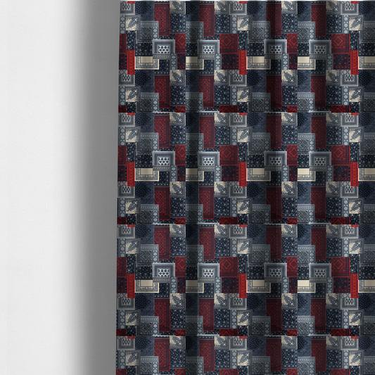 The fabric used to create these made-to-measure curtains is a patchwork-style fabric print featuring a repetitive arrangement of square and rectangular blocks. Each block is filled with intricate navy blue, red, and cream-coloured bandana and paisley motifs, creating a dense, geometric, and traditional textile pattern.