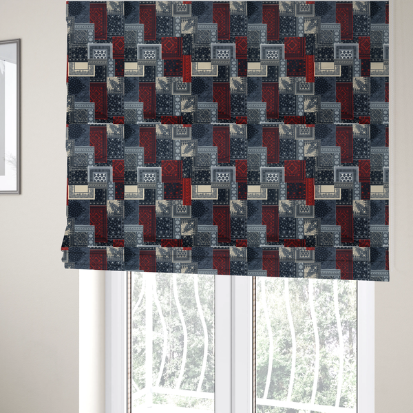The fabric used to create these Roman blinds is a patchwork-style fabric print featuring a repetitive arrangement of square and rectangular blocks. Each block is filled with intricate navy blue, red, and cream-coloured bandana and paisley motifs, creating a dense, geometric, and traditional textile pattern.