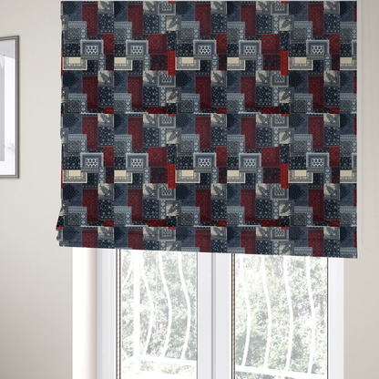 The fabric used to create these Roman blinds is a patchwork-style fabric print featuring a repetitive arrangement of square and rectangular blocks. Each block is filled with intricate navy blue, red, and cream-coloured bandana and paisley motifs, creating a dense, geometric, and traditional textile pattern.