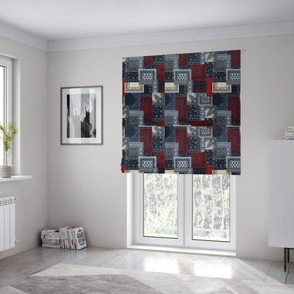 The fabric used to create these Roman blinds is a patchwork-style fabric print featuring a repetitive arrangement of square and rectangular blocks. Each block is filled with intricate navy blue, red, and cream-coloured bandana and paisley motifs, creating a dense, geometric, and traditional textile pattern.