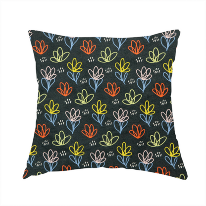 The fabric used to create this handmade cushion is a black fabric print featuring a modern, repeating pattern of colourful doodle-style floral outlines. The flowers are drawn in vibrant yellow, orange, pink, and light blue, accented by small white dash marks, creating a playful and artistic aesthetic.