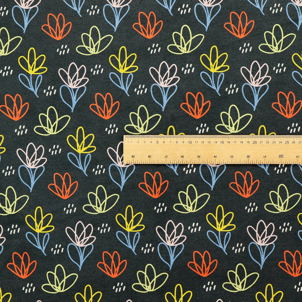 A black fabric print featuring a modern, repeating pattern of colourful doodle-style floral outlines. The flowers are drawn in vibrant yellow, orange, pink, and light blue, accented by small white dash marks, creating a playful and artistic aesthetic.