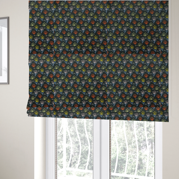 The fabric used to create these Roman blinds is a black fabric print featuring a modern, repeating pattern of colourful doodle-style floral outlines. The flowers are drawn in vibrant yellow, orange, pink, and light blue, accented by small white dash marks, creating a playful and artistic aesthetic.