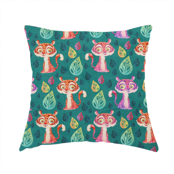 The fabric used to create this handmade cushion is a teal fabric print featuring a whimsical, repeating pattern of cute, cartoon-style baby tigers and stylized leaves. The tigers are rendered in vibrant shades of pink, orange, and purple, while the leaves appear in varied hues, creating a playful and colourful jungle-themed aesthetic
