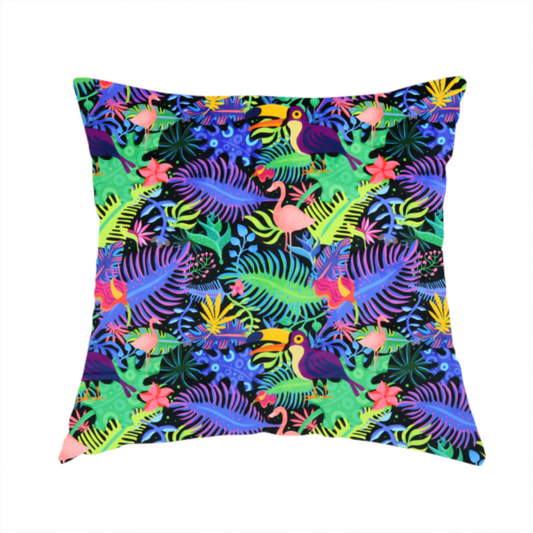 The fabric used to create this handmade cushion is a vibrant, tropical-themed fabric print featuring a dense pattern of colourful toucans, flamingos, and lush jungle leaves against a black background. The design incorporates bright neon hues of pink, purple, lime green, and yellow, creating a bold, exotic, and high-energy aesthetic.