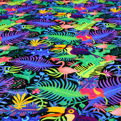 A vibrant, tropical-themed fabric print featuring a dense pattern of colourful toucans, flamingos, and lush jungle leaves against a black background. The design incorporates bright neon hues of pink, purple, lime green, and yellow, creating a bold, exotic, and high-energy aesthetic.
