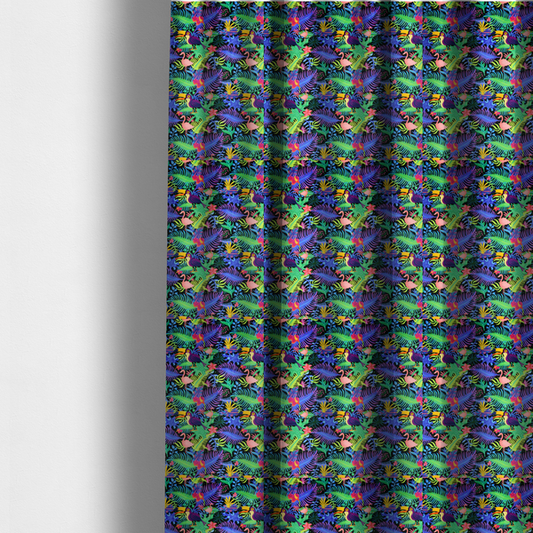 The fabric used to create these made-to-measure curtains is a vibrant, tropical-themed fabric print featuring a dense pattern of colourful toucans, flamingos, and lush jungle leaves against a black background. The design incorporates bright neon hues of pink, purple, lime green, and yellow, creating a bold, exotic, and high-energy aesthetic.