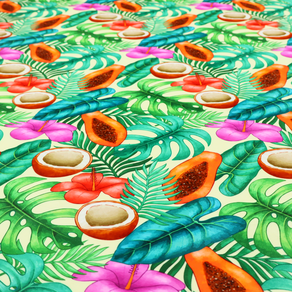 A lush, tropical-themed fabric print featuring a repeating pattern of halved papayas, coconuts, vibrant red and pink hibiscus flowers, and various green palm and monstera leaves against a light cream-colored background. The design has a hand-painted, watercolour style, creating a fresh, summery, and vacation-inspired aesthetic.
