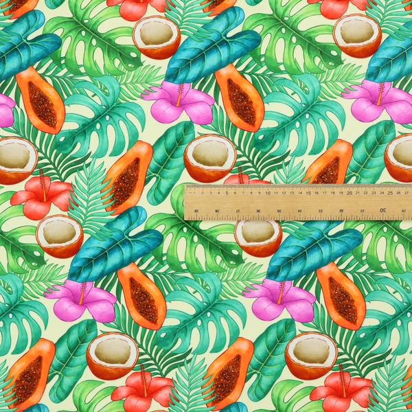 A lush, tropical-themed fabric print featuring a repeating pattern of halved papayas, coconuts, vibrant red and pink hibiscus flowers, and various green palm and monstera leaves against a light cream-colored background. The design has a hand-painted, watercolour style, creating a fresh, summery, and vacation-inspired aesthetic.
