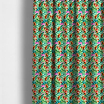 The fabric used to create these made-to-measure curtains is a lush, tropical-themed fabric print featuring a repeating pattern of halved papayas, coconuts, vibrant red and pink hibiscus flowers, and various green palm and monstera leaves against a light cream-colored background. The design has a hand-painted, watercolour style, creating a fresh, summery, and vacation-inspired aesthetic.
