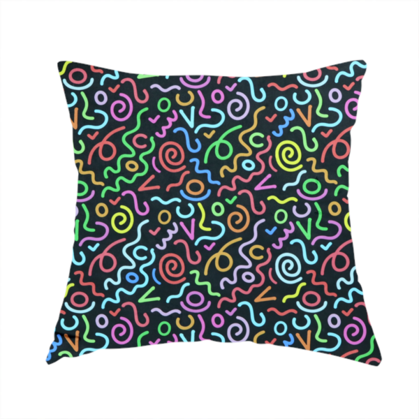 The fabric used to create this handmade cushion is a black fabric print featuring a retro, 90s-inspired pattern of colourful, hand-drawn-style doodles. The design includes vibrant neon swirls, squiggles, and V-shapes in shades of pink, yellow, blue, orange, and green, creating a nostalgic, high-energy, and playful aesthetic.