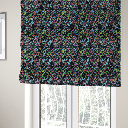 The fabric used to create these Roman blinds is a black fabric print featuring a retro, 90s-inspired pattern of colourful, hand-drawn-style doodles. The design includes vibrant neon swirls, squiggles, and V-shapes in shades of pink, yellow, blue, orange, and green, creating a nostalgic, high-energy, and playful aesthetic.