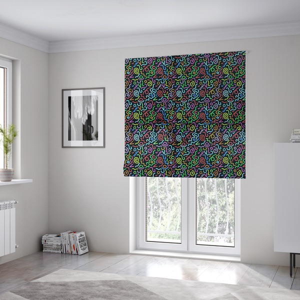 The fabric used to create these Roman blinds is a black fabric print featuring a retro, 90s-inspired pattern of colourful, hand-drawn-style doodles. The design includes vibrant neon swirls, squiggles, and V-shapes in shades of pink, yellow, blue, orange, and green, creating a nostalgic, high-energy, and playful aesthetic.