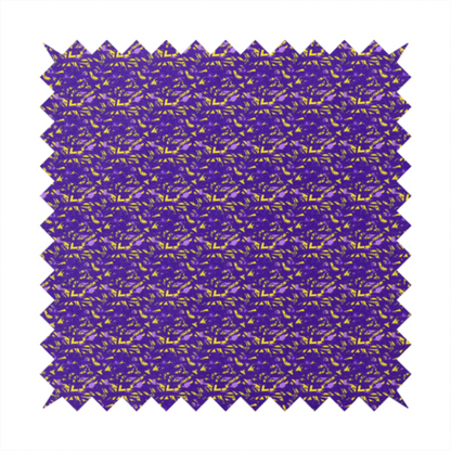 A vibrant fabric print featuring a dense, abstract pattern of bright yellow, sharp-edged shapes scattered across a deep, solid purple background. The design creates a textured, dynamic, and modern look.