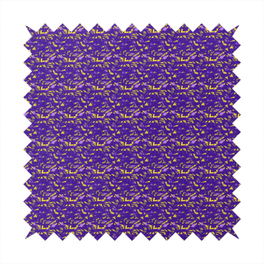 A vibrant fabric print featuring a dense, abstract pattern of bright yellow, sharp-edged shapes scattered across a deep, solid purple background. The design creates a textured, dynamic, and modern look.
