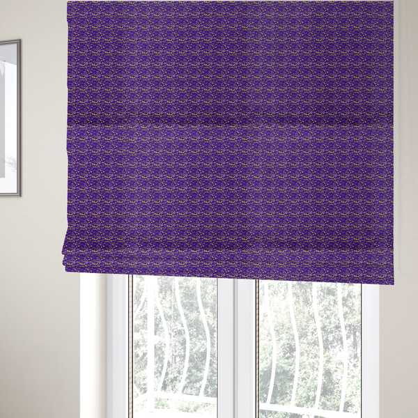The fabric used to create these Roman blinds is a vibrant fabric print featuring a dense, abstract pattern of bright yellow, sharp-edged shapes scattered across a deep, solid purple background. The design creates a textured, dynamic, and modern look.