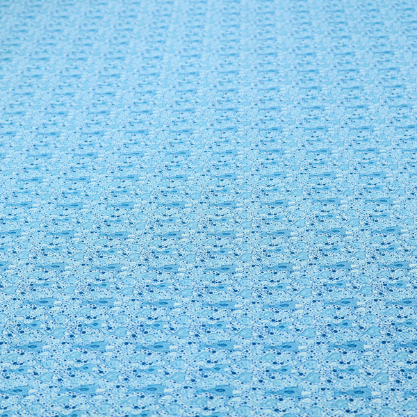 A light blue fabric print featuring a repetitive, minimalist pattern of tiny whales and scattered bubbles. The design uses varying shades of blue to create a soft, calming, and playful aquatic aesthetic.