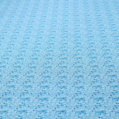 A light blue fabric print featuring a repetitive, minimalist pattern of tiny whales and scattered bubbles. The design uses varying shades of blue to create a soft, calming, and playful aquatic aesthetic.