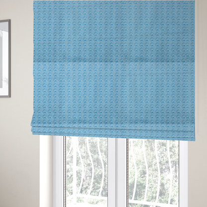 The fabric used to create these Roman blinds is a light blue fabric print featuring a repetitive, minimalist pattern of tiny whales and scattered bubbles. The design uses varying shades of blue to create a soft, calming, and playful aquatic aesthetic.