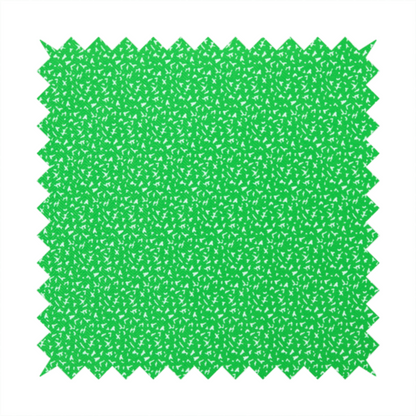 A bright, vibrant green fabric print featuring a repetitive, minimalist pattern of small, white, irregular flecks or specks. The design creates a textured, clean, and modern look.
