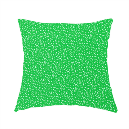 The fabric used to create this handmade cushion is a bright, vibrant green fabric print featuring a repetitive, minimalist pattern of small, white, irregular flecks or specks. The design creates a textured, clean, and modern look.