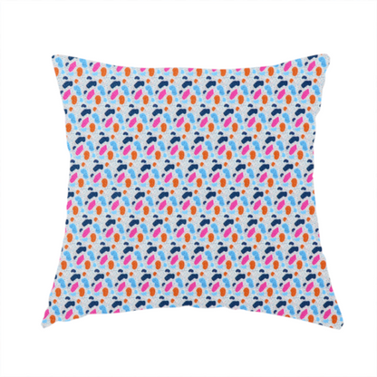 The fabric used to create this handmade cushion is a fabric features a playful, confetti-inspired terrazzo pattern set against a light grey, speckled background.