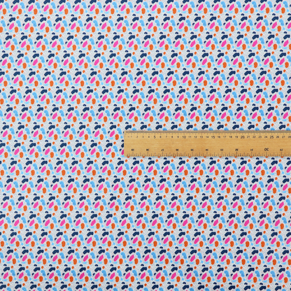This fabric features a playful, confetti-inspired terrazzo pattern set against a light grey, speckled background.