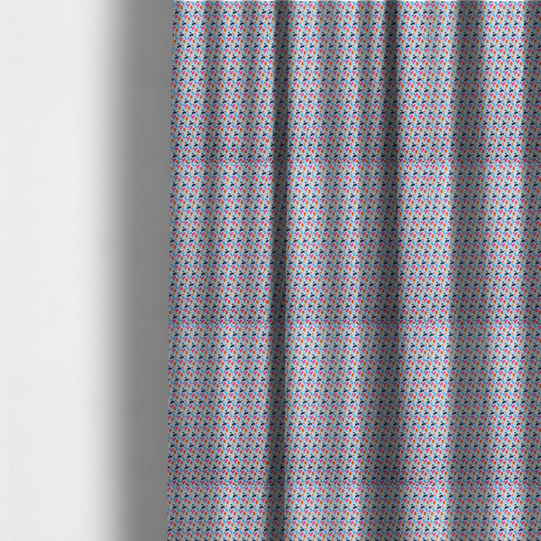 The fabric used to create these made-to-measure curtains is a fabric features a playful, confetti-inspired terrazzo pattern set against a light grey, speckled background.