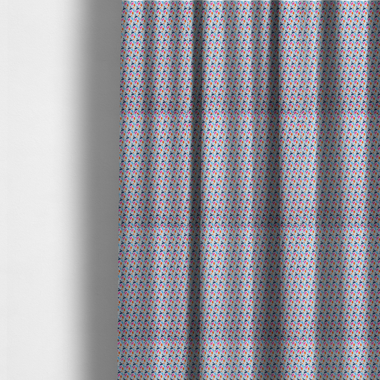 The fabric used to create these made-to-measure curtains is a fabric features a playful, confetti-inspired terrazzo pattern set against a light grey, speckled background.