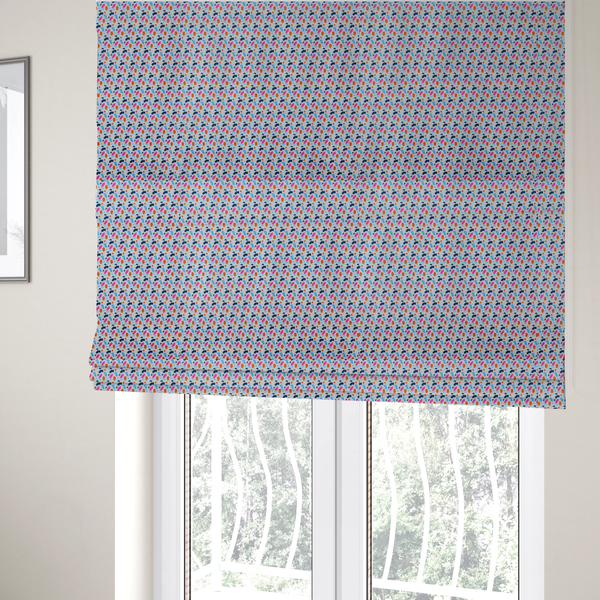 The fabric used to create these Roman blinds is a fabric features a playful, confetti-inspired terrazzo pattern set against a light grey, speckled background.