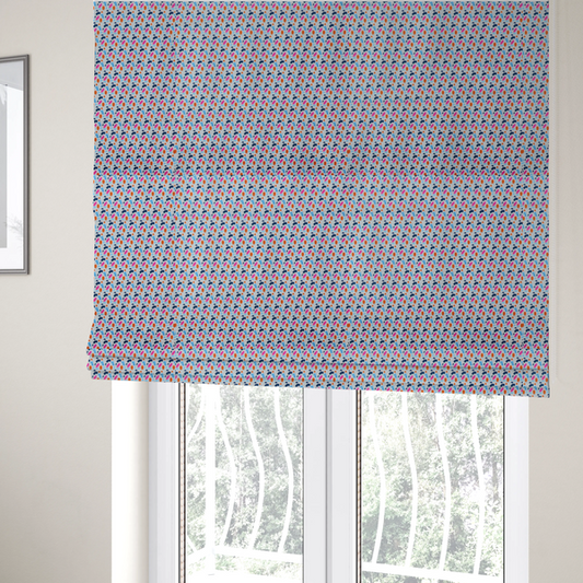 The fabric used to create these Roman blinds is a fabric features a playful, confetti-inspired terrazzo pattern set against a light grey, speckled background.