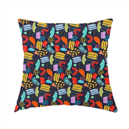 The fabric used to create this handmade cushion is a fabric features a lively, abstract pattern set against a deep navy background. The design is filled with a dense, colourful array of hand-drawn shapes, including squiggles, small arches, and organic blobs in a vibrant palette of yellow, red, orange, teal, light blue, and purple.