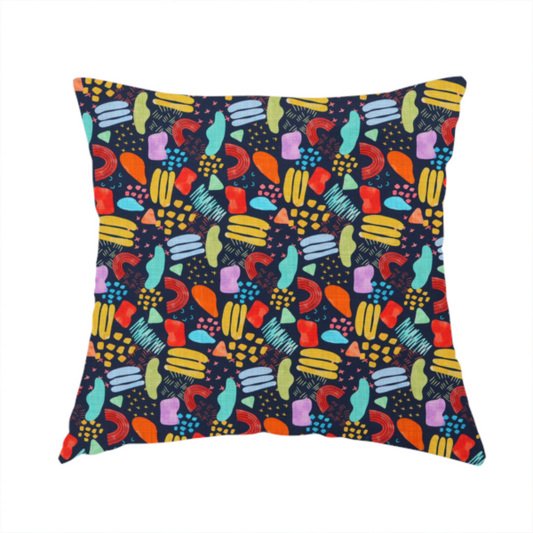 The fabric used to create this handmade cushion is a fabric features a lively, abstract pattern set against a deep navy background. The design is filled with a dense, colourful array of hand-drawn shapes, including squiggles, small arches, and organic blobs in a vibrant palette of yellow, red, orange, teal, light blue, and purple.