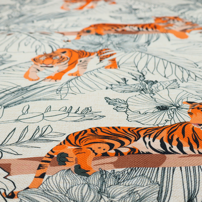 This fabric features a repeating botanical and wildlife pattern set against a light cream and grey background. The design showcases tigers in two poses—some walking and some resting—interspersed with detailed line drawings of large tropical leaves and hibiscus flowers.