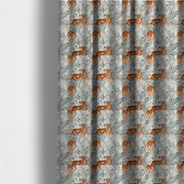The fabric used to create these made-to-measure curtains is a fabric features a repeating botanical and wildlife pattern set against a light cream and grey background. The design showcases tigers in two poses—some walking and some resting—interspersed with detailed line drawings of large tropical leaves and hibiscus flowers.