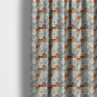 The fabric used to create these made-to-measure curtains is a fabric features a repeating botanical and wildlife pattern set against a light cream and grey background. The design showcases tigers in two poses—some walking and some resting—interspersed with detailed line drawings of large tropical leaves and hibiscus flowers.