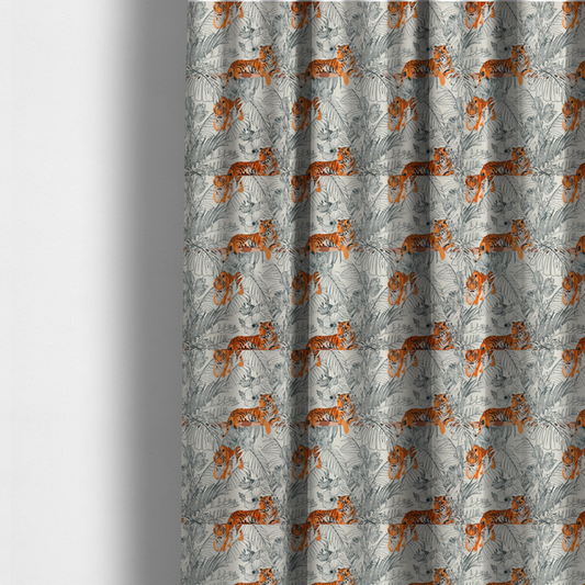 The fabric used to create these made-to-measure curtains is a fabric features a repeating botanical and wildlife pattern set against a light cream and grey background. The design showcases tigers in two poses—some walking and some resting—interspersed with detailed line drawings of large tropical leaves and hibiscus flowers.
