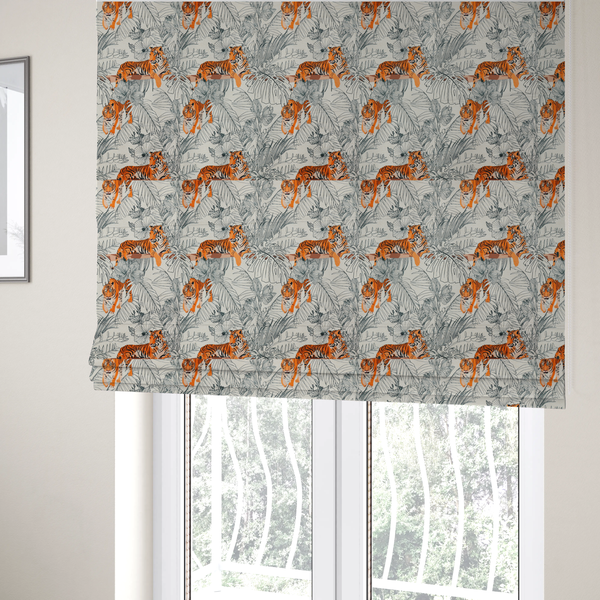 The fabric used to create these Roman blinds is a fabric features a repeating botanical and wildlife pattern set against a light cream and grey background. The design showcases tigers in two poses—some walking and some resting—interspersed with detailed line drawings of large tropical leaves and hibiscus flowers.
