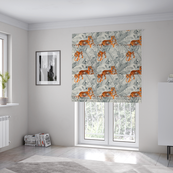 The fabric used to create these Roman blinds is a fabric features a repeating botanical and wildlife pattern set against a light cream and grey background. The design showcases tigers in two poses—some walking and some resting—interspersed with detailed line drawings of large tropical leaves and hibiscus flowers.