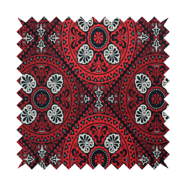 This fabric features an intricate, medallion-style damask pattern with a striking gothic influence. The design is composed of repeating circular motifs containing ornate, symmetrical floral and fan-shaped elements in cream, set against a dark charcoal-black backdrop.